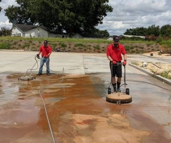 Fist Class professionals cleaning concrete
